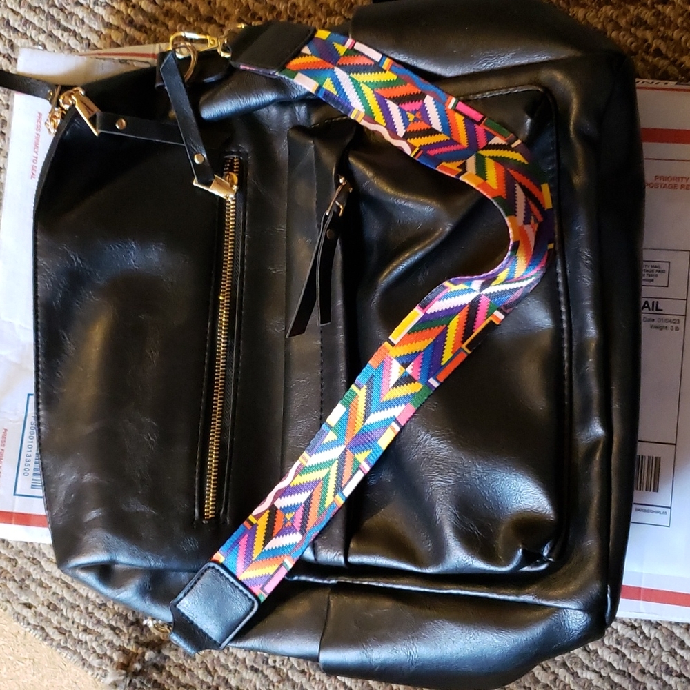 Unbranded black backpack with back straps and crossbody or shoulder bag